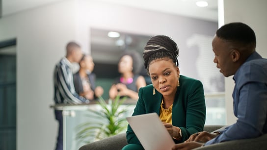 Business people brainstorming in office lobby