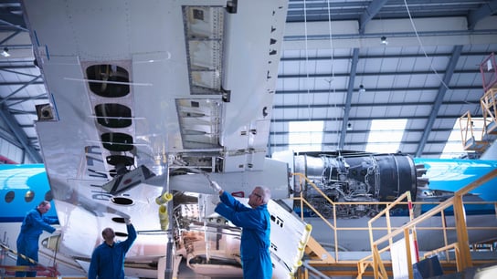 Engineers working on a plane