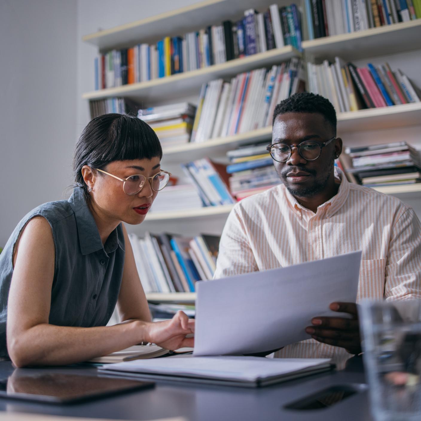 Woman explaining some analysis to coworker