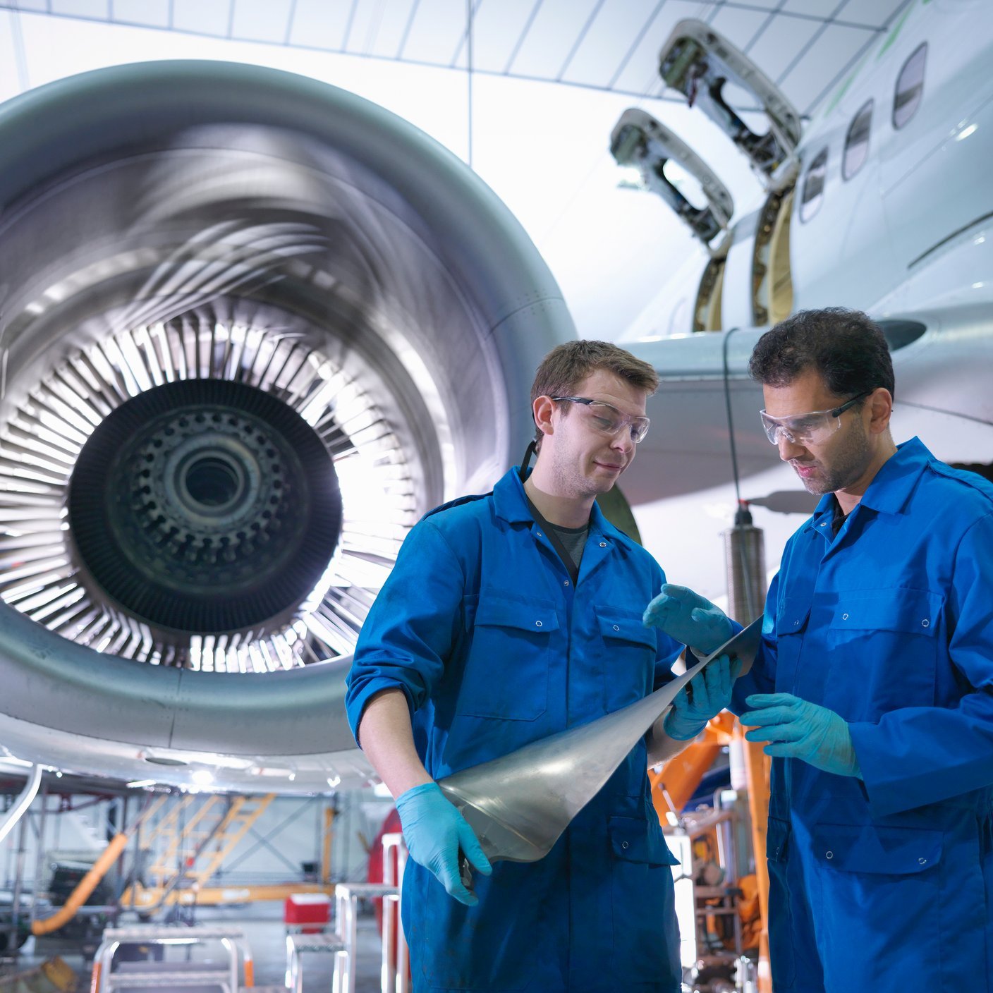 Engineers working on airplane