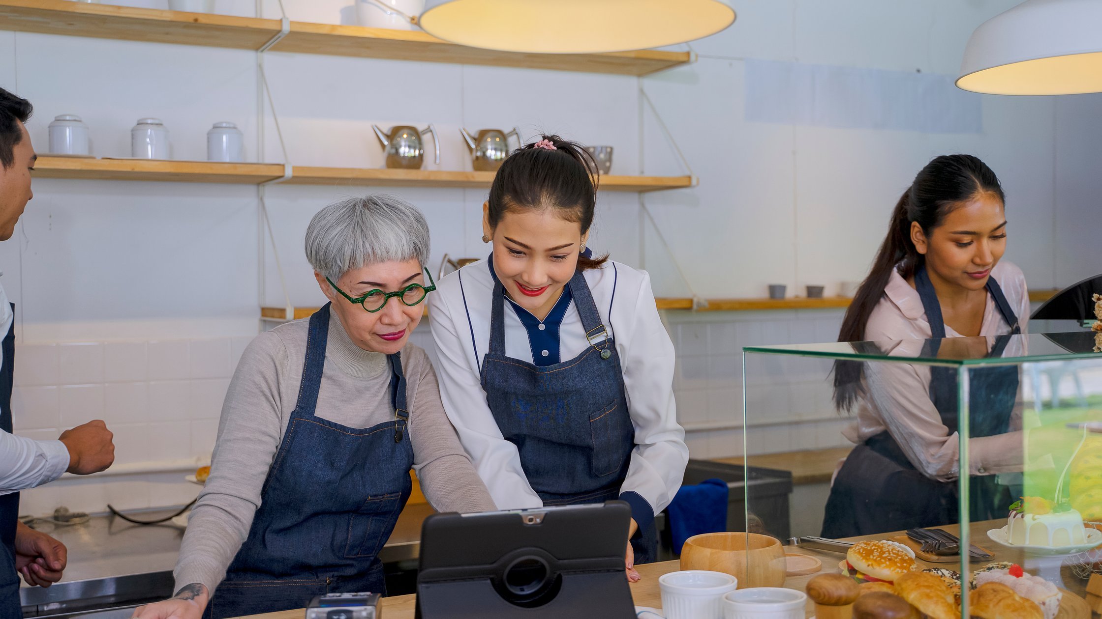 Entrepreneur and teamwork at bakery and coffee café. 