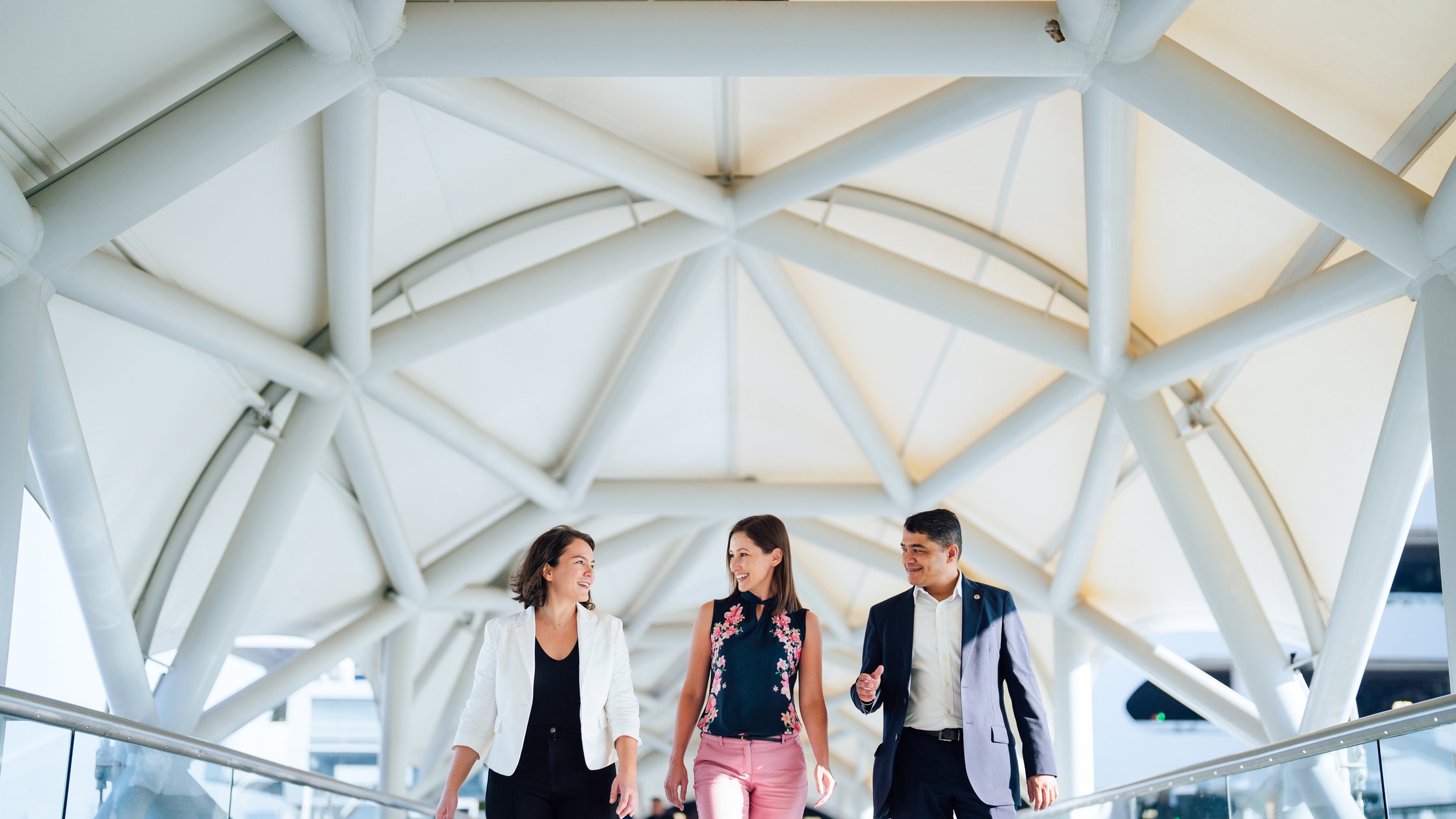 A group of people discussing on walkway